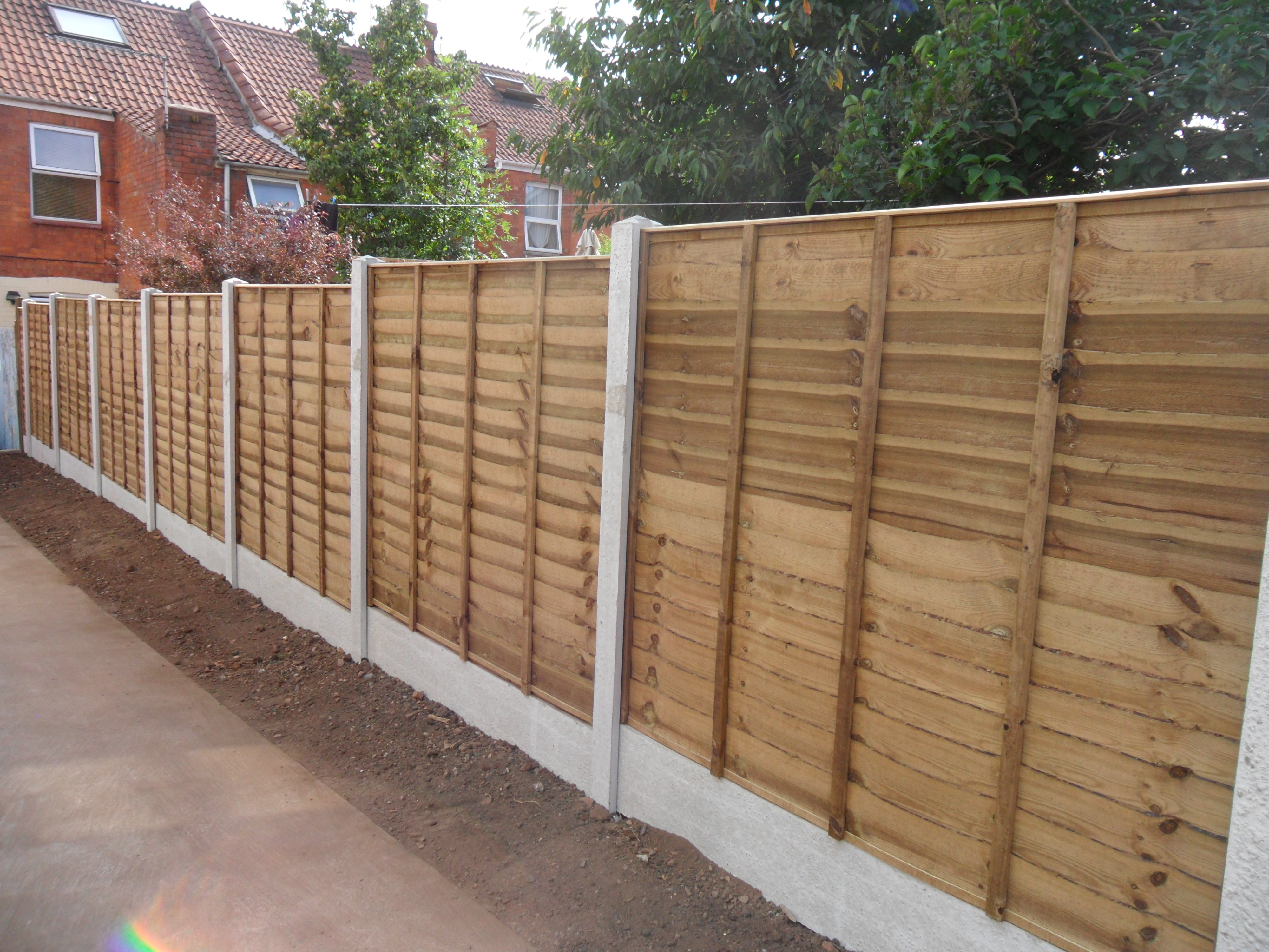Luxury Waney with Concrete Posts & Gravel Boards